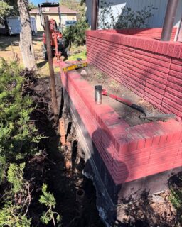 Oh the ‘60’s when concrete was cheap! This step was a few truckloads of solid concrete fastened into the basement wall. As the 24” concrete piles settled over the decades, the basement wall cracked on both sides of the step and pulled away. Lifted it a few inches and now it’ll never move again! #screwpiles #foundationlifting #foundationrepair #camrose #alberta #helicalpiles